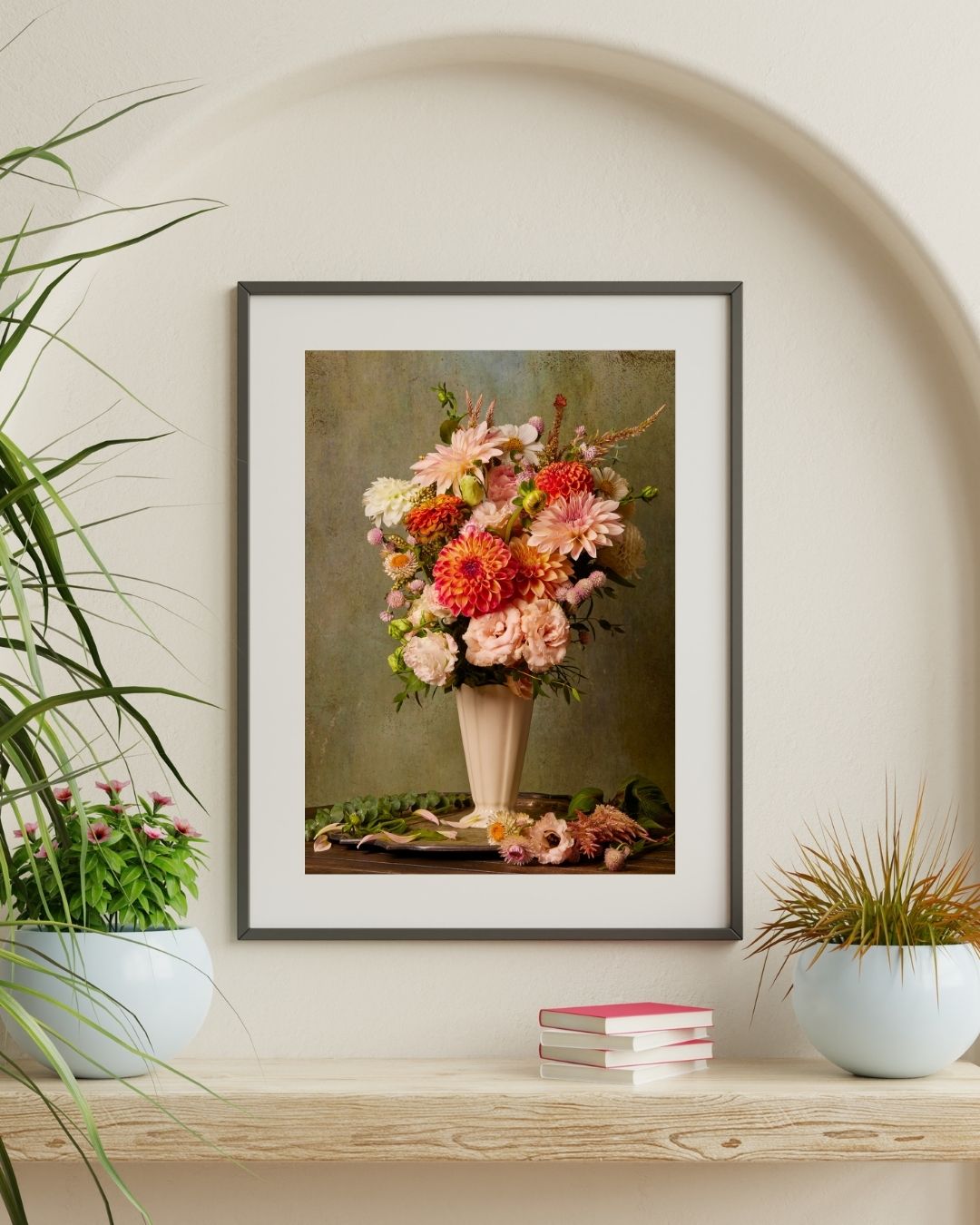 A minimalist room features the Victorian Bouquet canvas wall art. Beneath it, a wooden sideboard holds some books and potted plants.