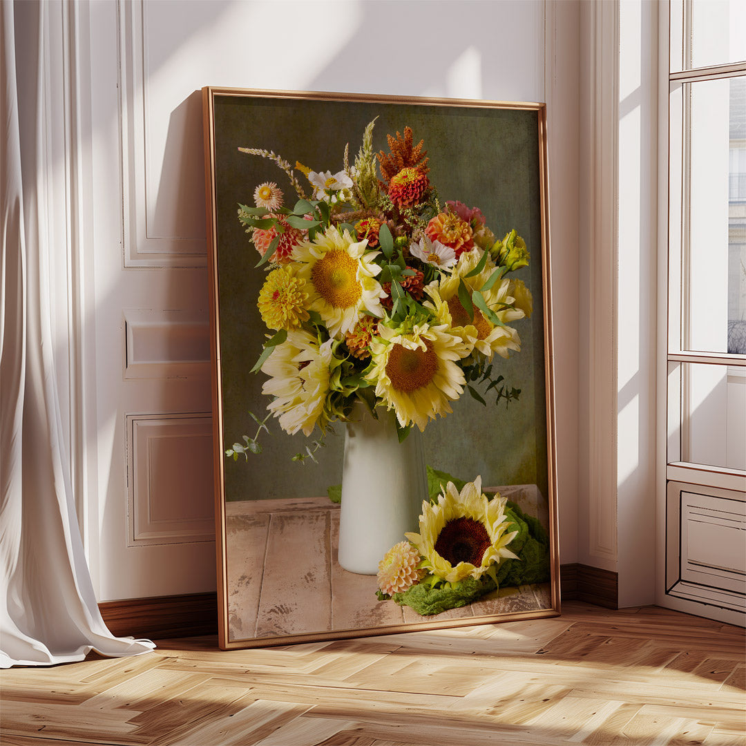 Showing the Sunny Bouquet canvas wall art in a frame featuring a vibrant sunflower bouquet with colorful flowers in a white vase against the wall. Sunlight streams through a nearby window, casting shadows on the wooden floor next to the canvas.