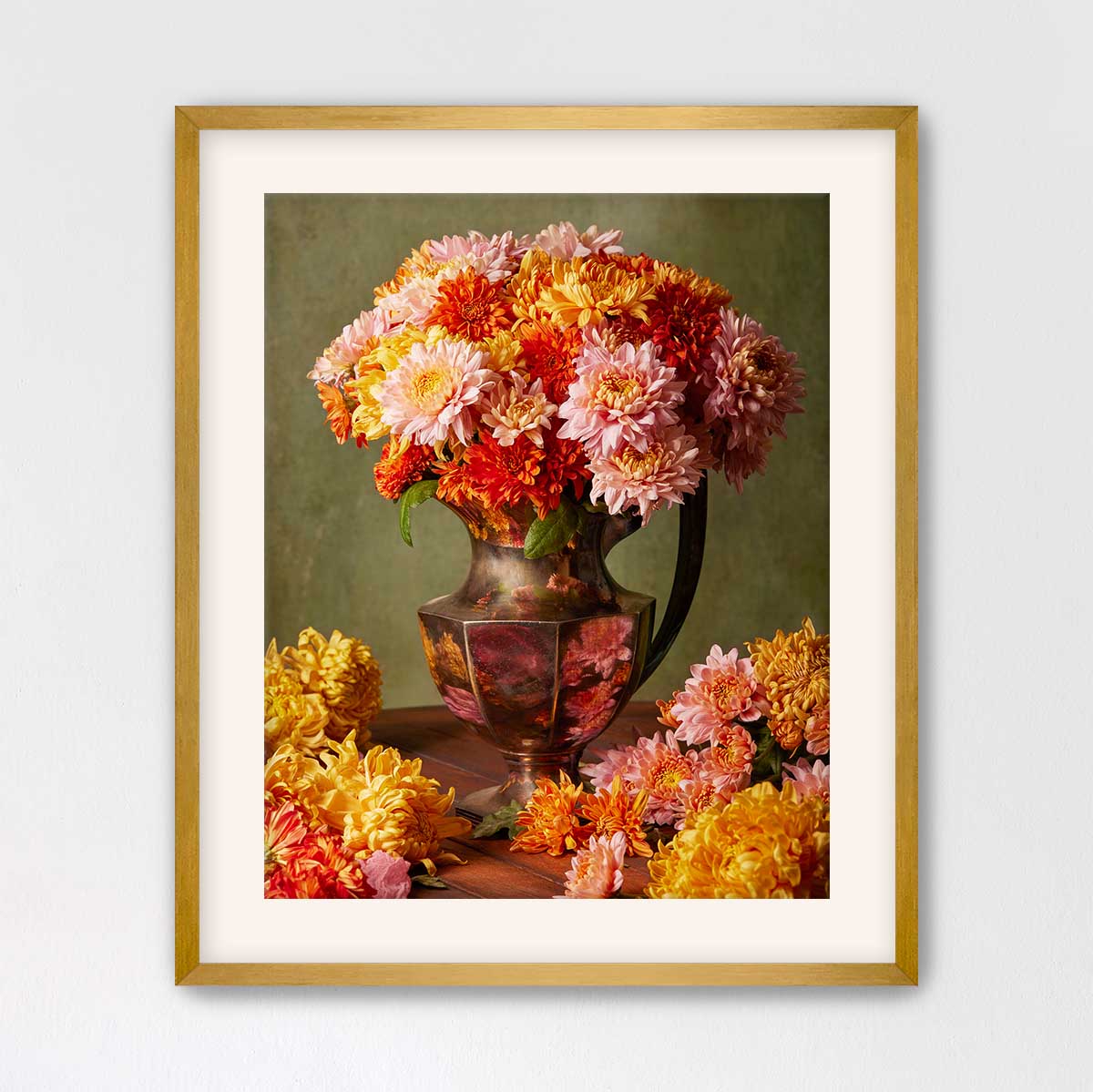 A framed image of a vase filled with a vibrant bouquet of colorful flowers, including pink, orange, and yellow blooms, set against a green background.
