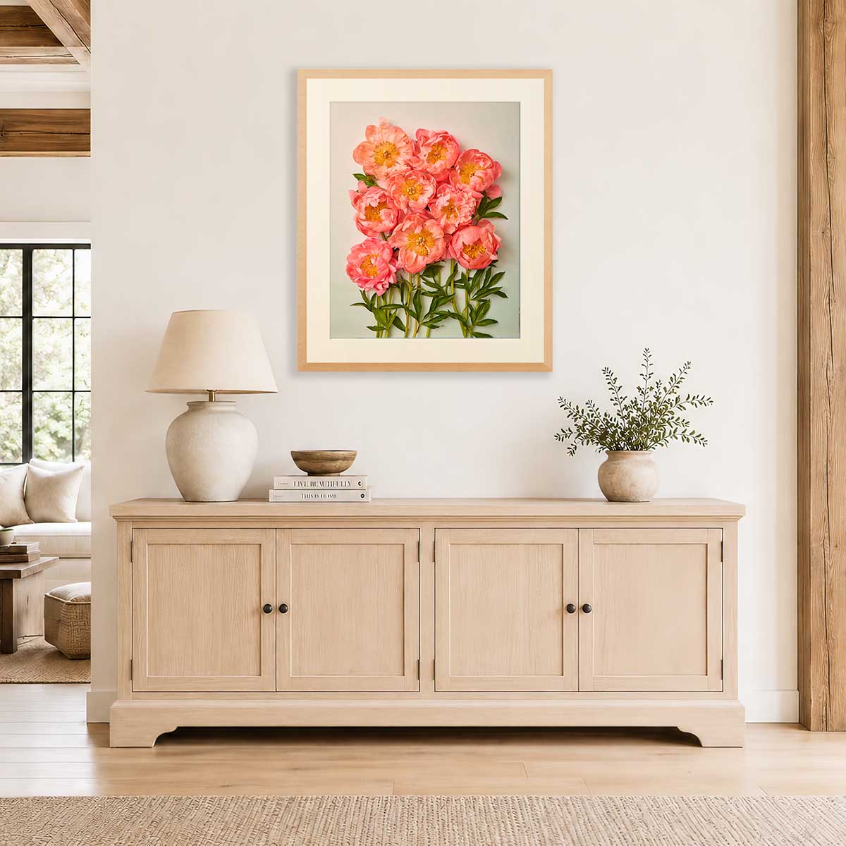 Coral Charm Garden Peony Wall Art Print with coral peonies in a gold frame on a living room wall