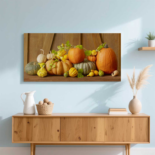 Harvest Festival wall art canvas print with orange pumpkins, green gourds, and yellow squash on a shelf wall
