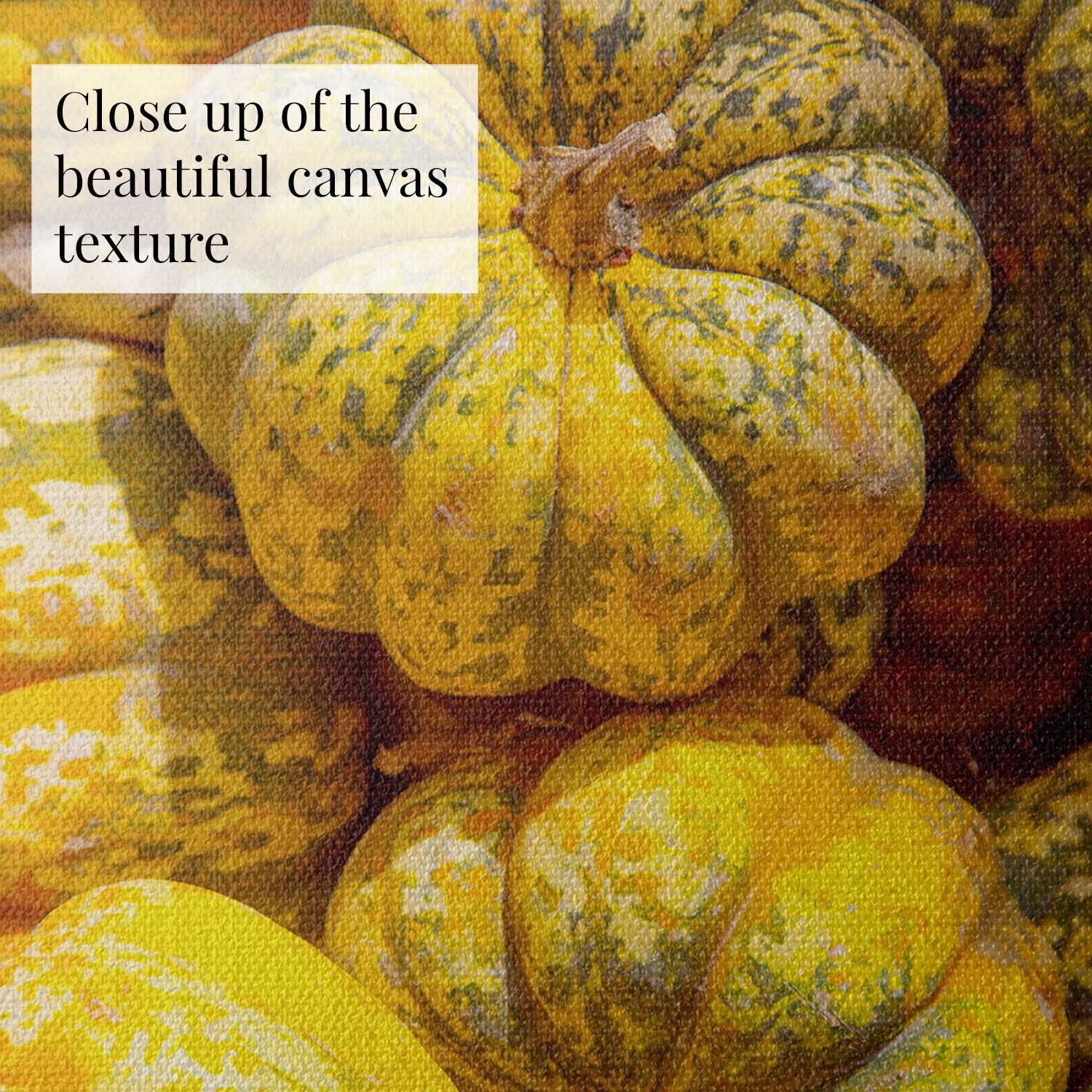 Close-up of textured canvas with yellow and green carnival pumpkins