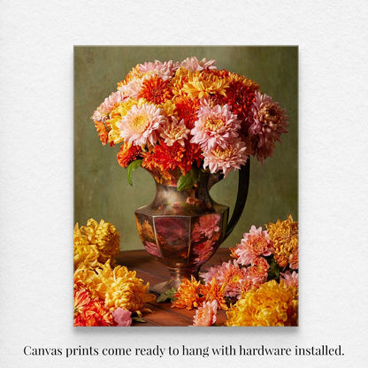 The Harvested Harmony canvas wall art features a vintage vase with pink and orange chrysanthemums, classic autumn blooms, on a wooden table. Additional flowers scatter around the base. The canvas comes ready to hang with installed hardware.