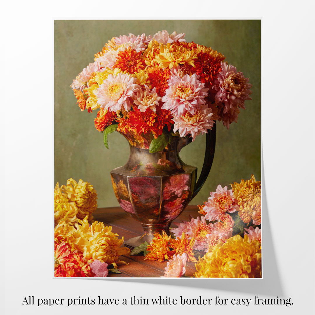 The Harvested Harmony image showcases a vibrant bouquet of pink, orange, and yellow autumn flowers in an ornate vase on a wooden table, with additional flowers scattered around. All paper prints come with a thin white border for easy framing.