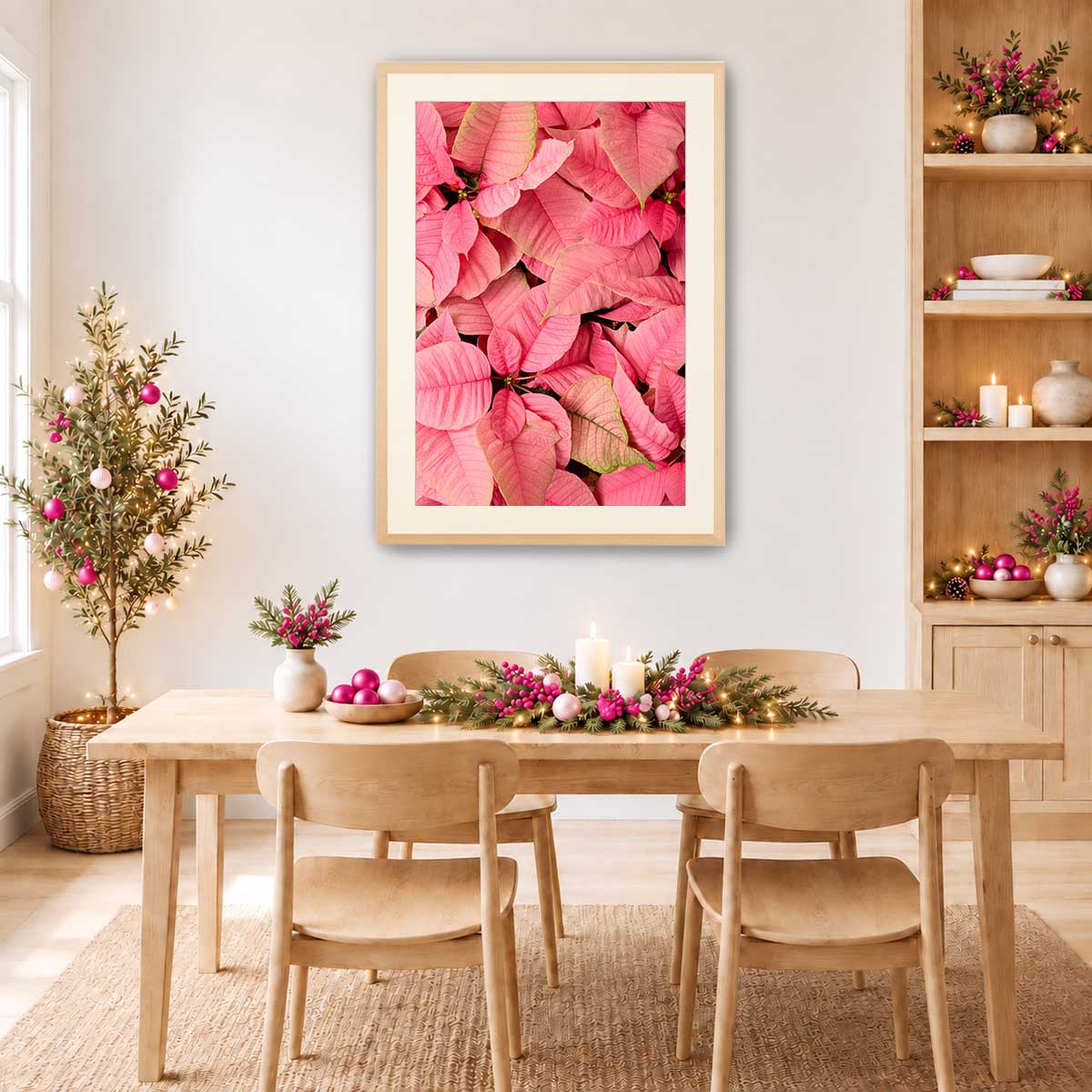 Poinsettia wall art canvas in pink with detailed floral veins, shown as a vertical Christmas display in a light wood frame