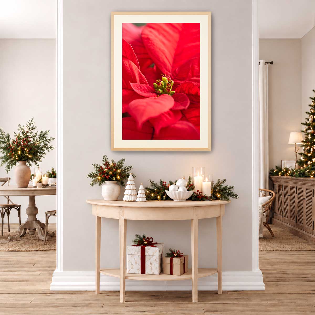 Brilliant red wall art canvas featuring close-up poinsettia petals, presented vertically in a light wood frame.