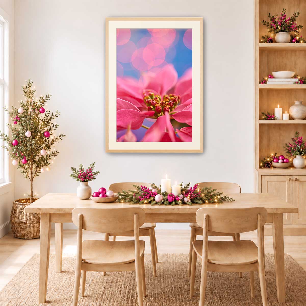 Poinsettia wall art print featuring vivid pink petals and a close up floral composition in a maple frame.