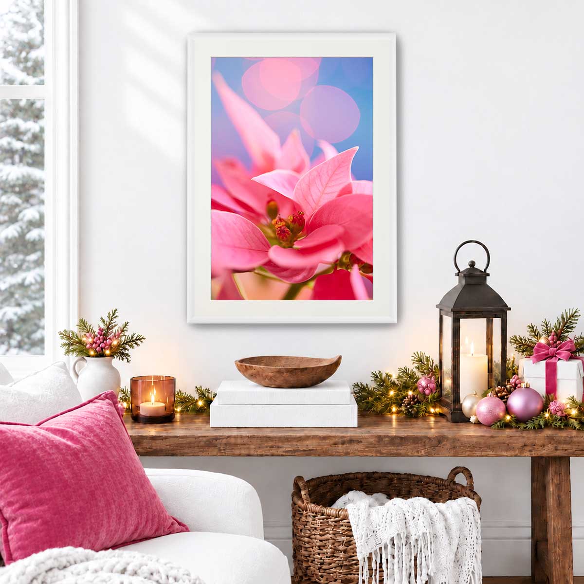 Pink poinsettia Christmas wall art canvas hangs vertically in a white frame, showing layered petals against a blue