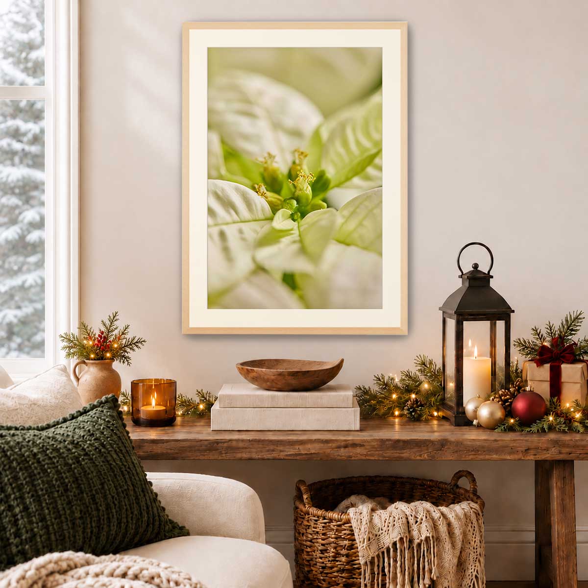 Poinsettia floral wall art print with softly blurred bracts in a light wood frame, displayed above a console