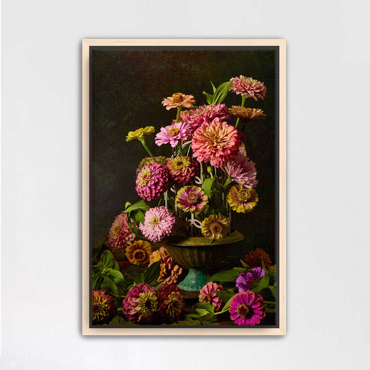 A framed painting depicting a vibrant bouquet of colorful flowers, including pink, orange, and yellow blooms, arranged in a vase.