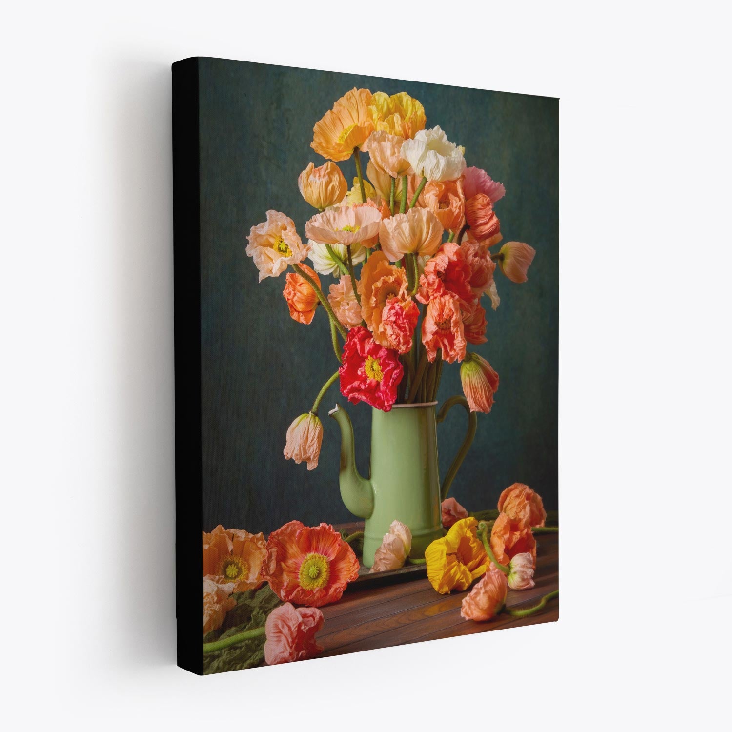 The Poppy Sisters Portraits - 3 Piece features vibrant orange, pink, and white Italian pastel poppies in a green teapot overflowing onto a wooden table against a muted dark background.