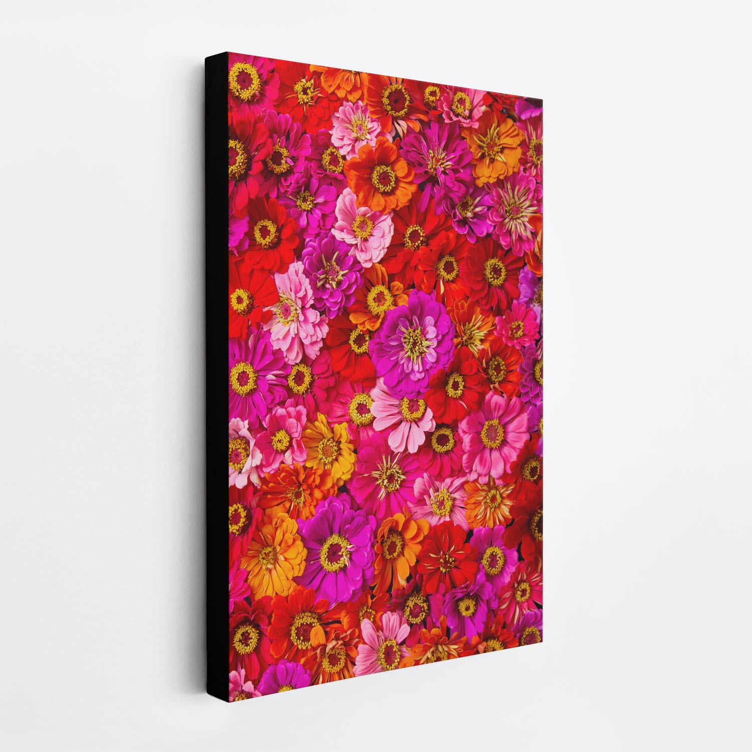 Side view of the Zinnia Bed - Electric Radiance canvas wall art. The canvas has a 1.5-inch black edge, producing a floating effect from the wall.