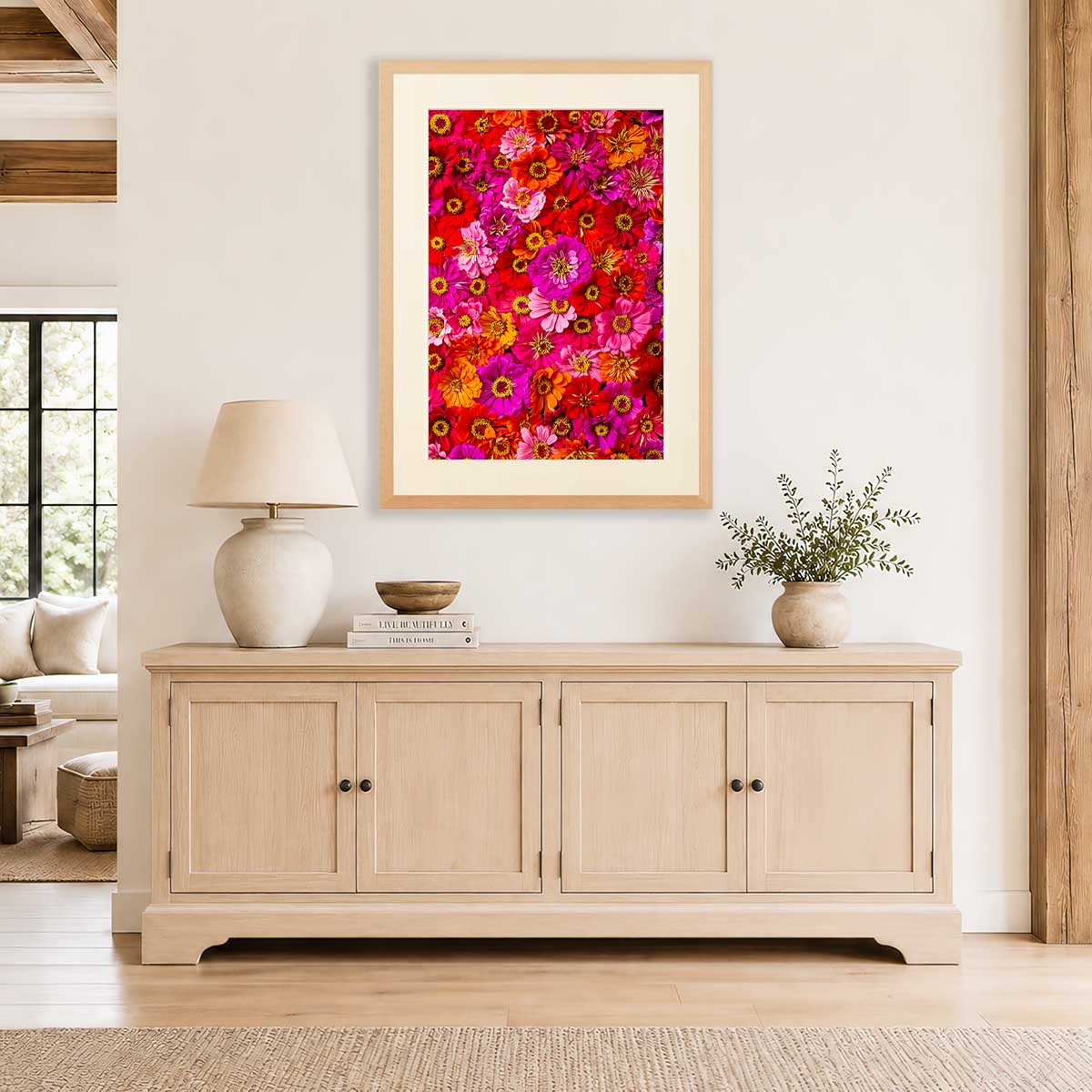Zinnias Electric Radiance Wall Art Print with gold earrings style, framed floral print in a bright living room