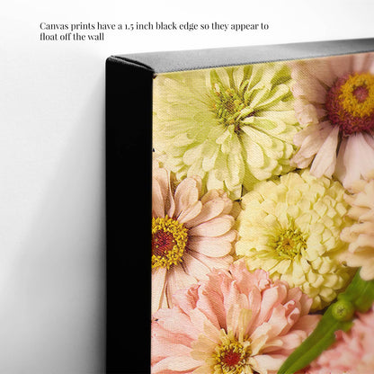 Close-up of Zinnia Bed - Dawn To Dusk canvas wall art with pink and white zinnias, featuring a 1.5-inch black edge. The image text highlights its floating appearance on the wall.