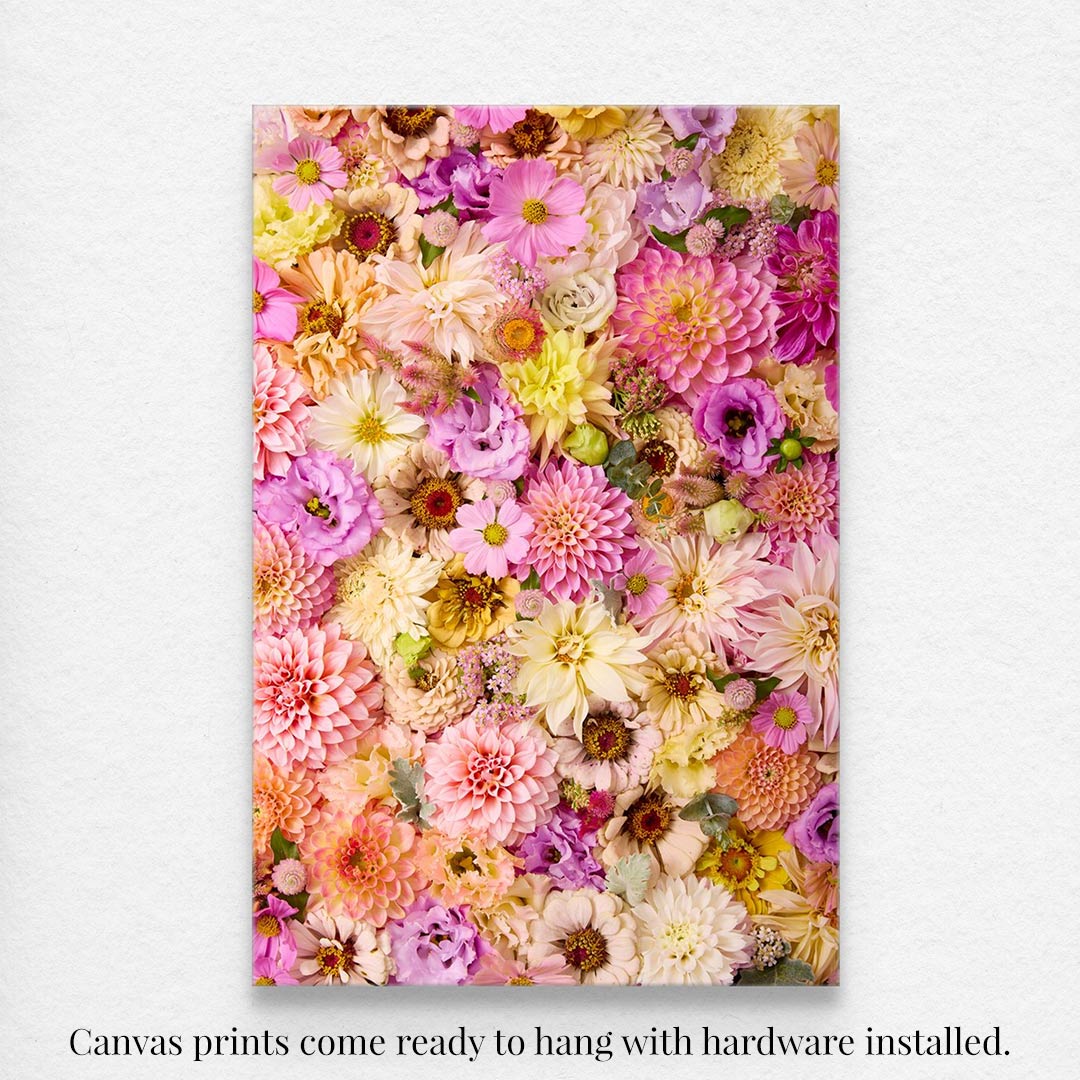 Christinas Wedding, a vibrant floral canvas wall art, showcases pink, yellow, and purple blossoms closely arranged. Comes ready to hang with hardware installed.