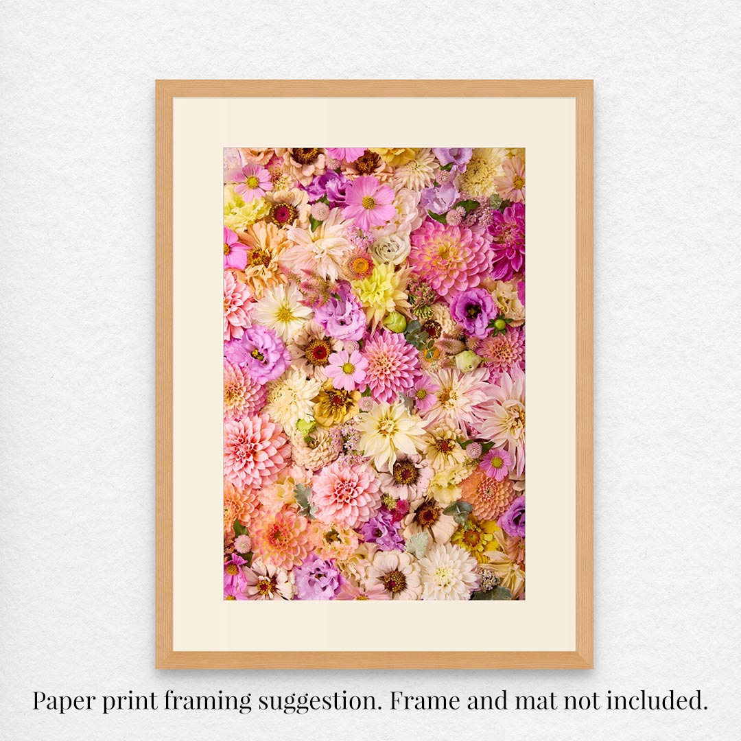 Framed print, Christinas Wedding, showcases vibrant pink, purple, yellow, and white flowers. It features a light wood frame and cream mat; note the text: Paper print framing suggestion. Frame and mat not included.