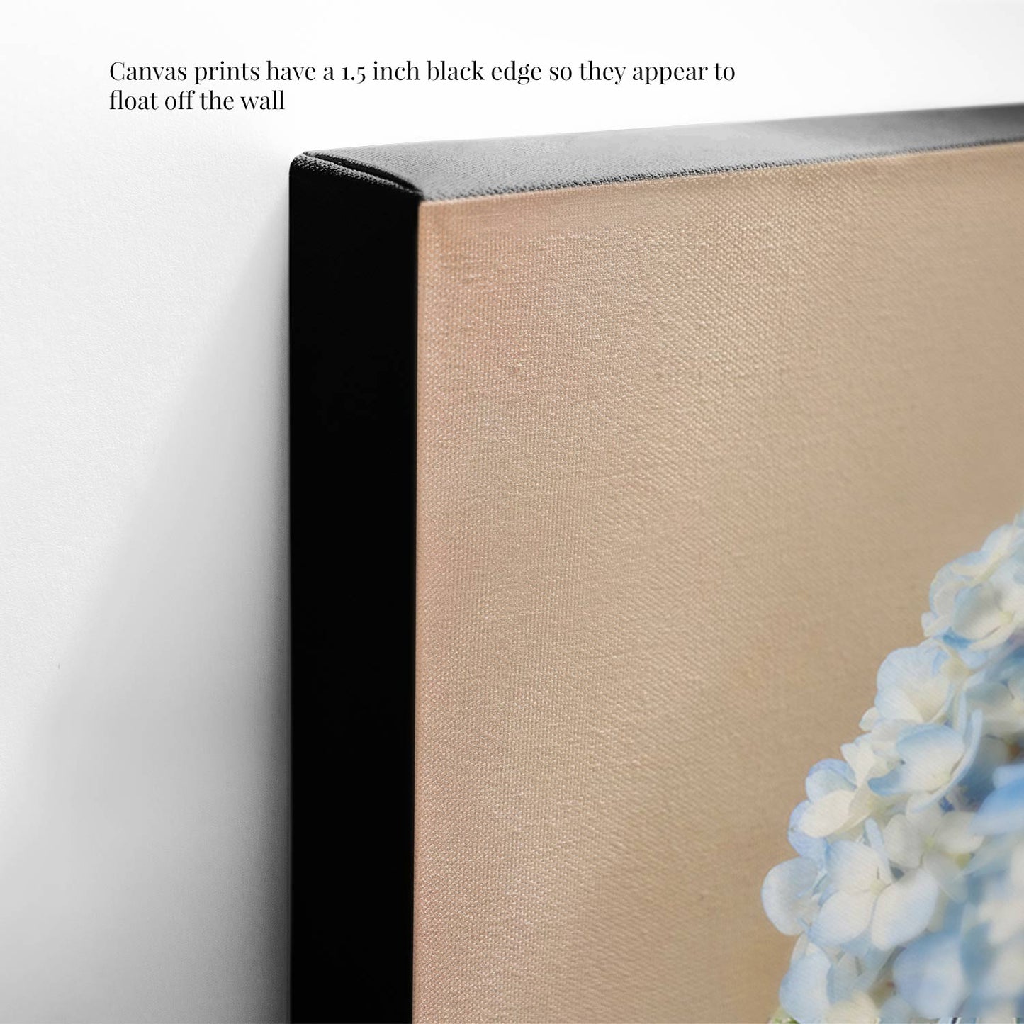 Close-up of Dreaming of Something Blue canvas wall art with a 1.5-inch black edge for a floating effect, the artwork showing delicate blue hydrangeas against a gentle background, adding an elegant touch to your space.