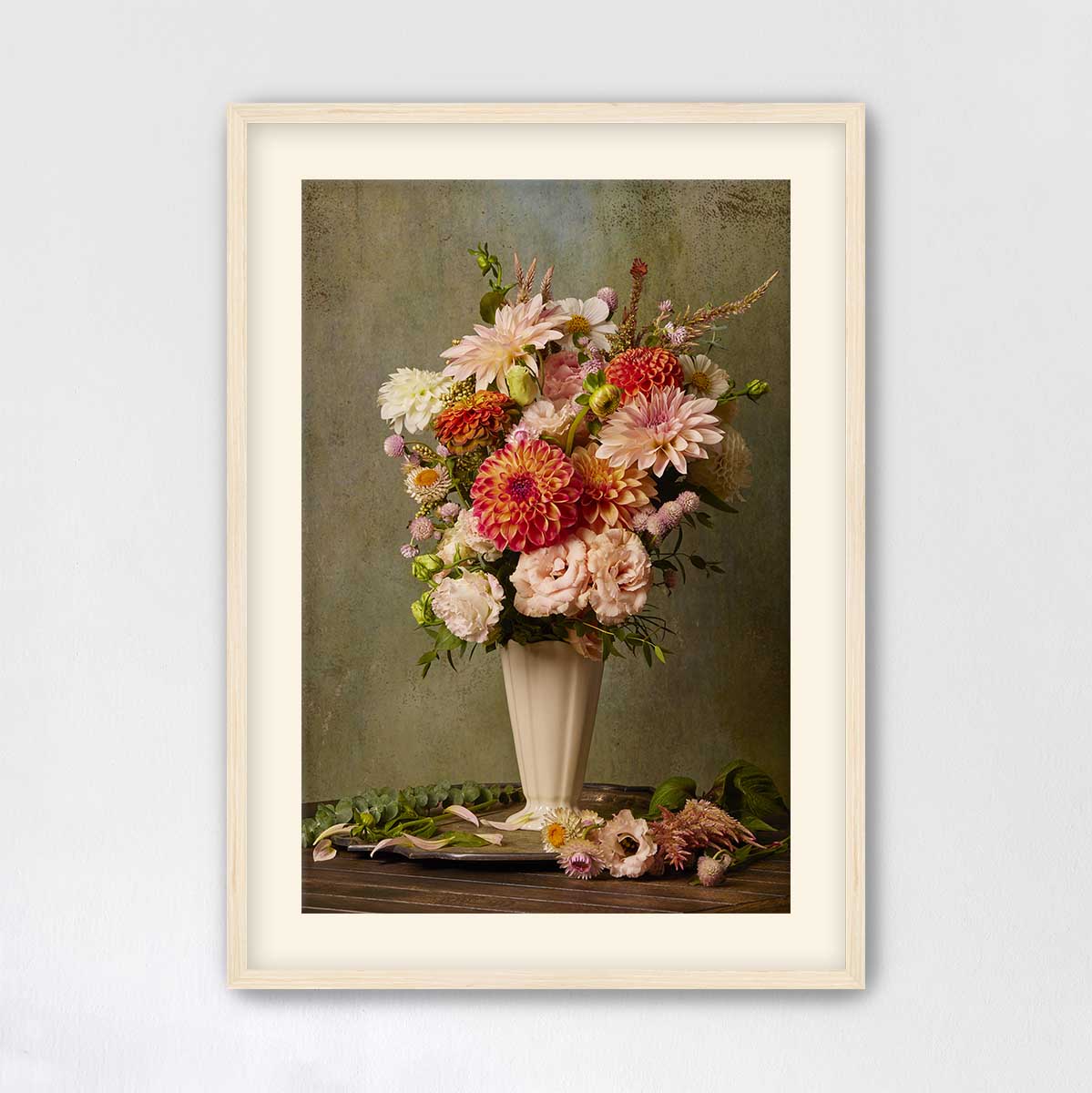 A framed image of a vase filled with a vibrant bouquet of flowers, including various types of blooms in shades of pink, orange, and white, set against a neutral background.