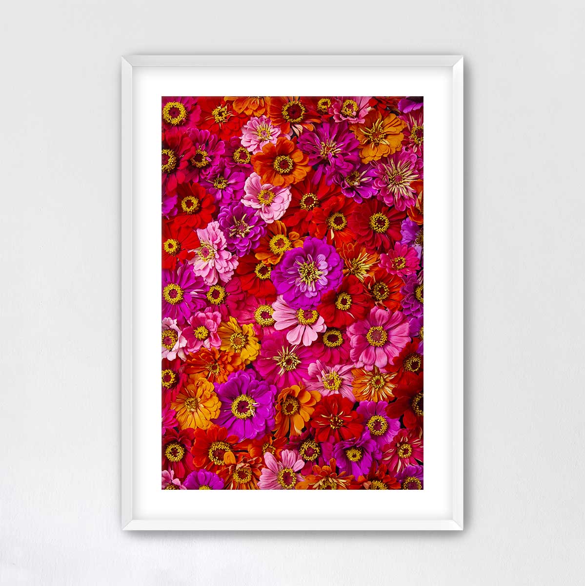 The image is a vibrant and colorful collage of various flowers, including sunflowers, roses, and daisies, arranged in a visually appealing manner.