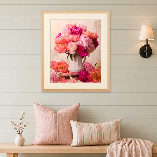 Blushing Hearts Peonies wall art print with coral and pink flowers in a gold frame on a light wall