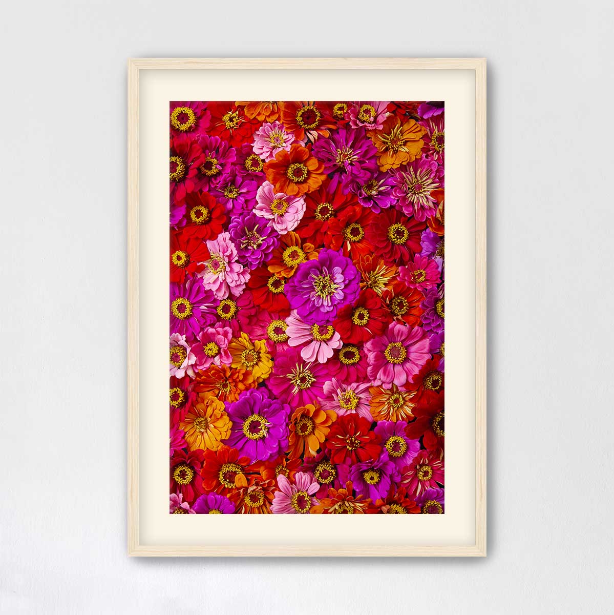 The image is a vibrant and colorful collage of various flowers, including sunflowers, roses, and daisies, arranged in a visually appealing manner.