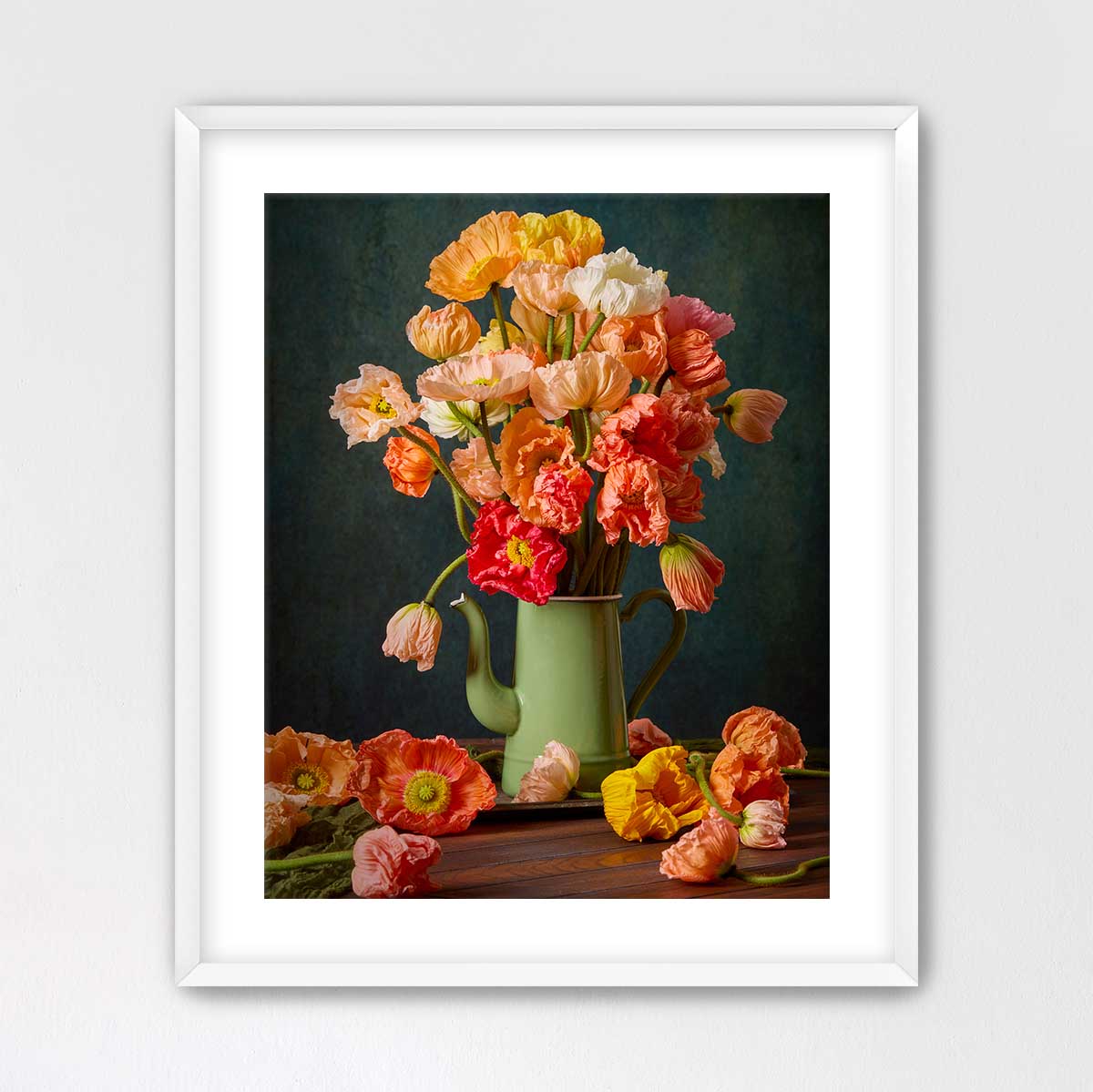 A framed image of a vase filled with a variety of colorful flowers, including red, orange, and yellow blooms, set against a dark background.