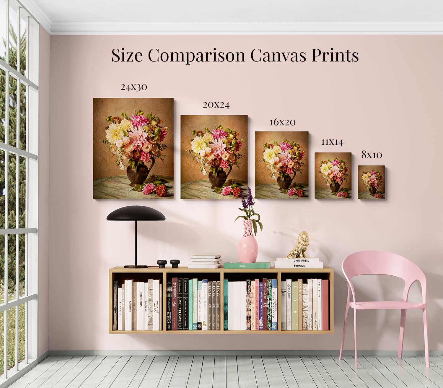 Against a pink wall, five Steeping Beauty canvas prints from 24x30 to 8x10 inches adorn the room. Below, a floating shelf displays books and decor like a vintage green teapot and modern lamp, while a pink chair sits on the right. Sunlight spills through the window.