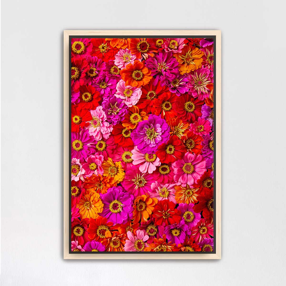 The image is a vibrant and colorful collage of various flowers, including sunflowers, roses, and daisies, arranged in a visually appealing manner.